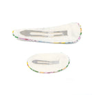Two fabric-covered hair clips with metal fasteners on a white background.