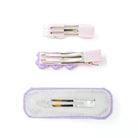 Three hair clips with silver clips.