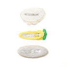 Three decorated hair clips showing the back of each clip.