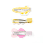 Three hair clips with yellow and pink colors.