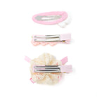 Three decorative pink and silver hair clips.