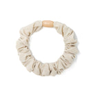 Beige scrunchie with wooden toggle.
