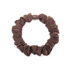 Brown scrunchie on a white background.
