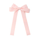 Light pink ribbon bow with long tails.