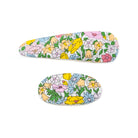 Two floral-patterned hair clips.