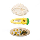 Three embroidered hair clips.