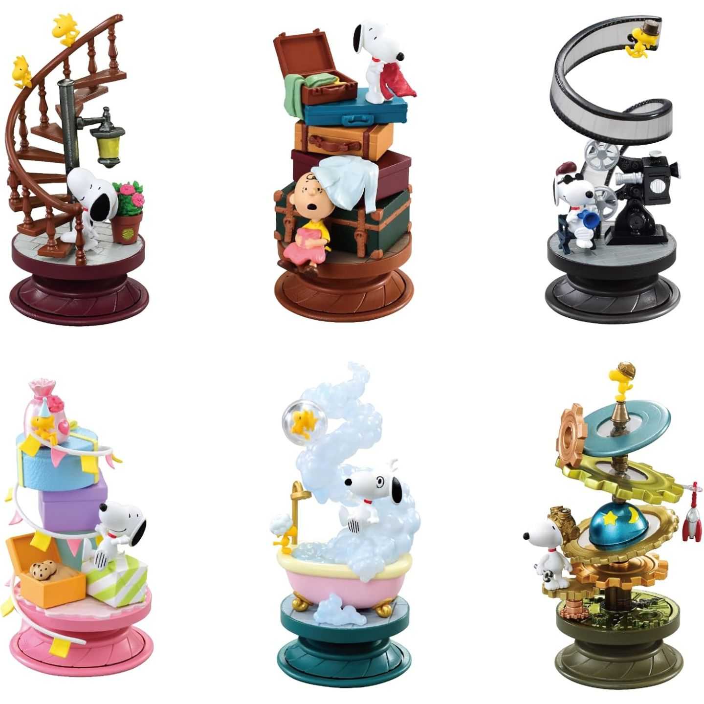 Set of Snoopy-themed figurines on a white background