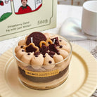 Handmade scented candle with Oreo cookie design on a white surface