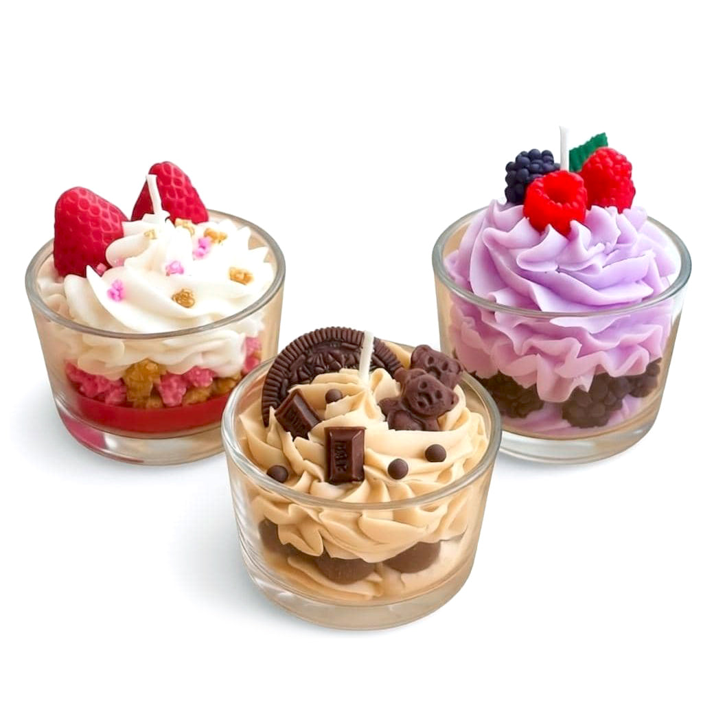 Three small dessert cups with different flavors and toppings on a white background