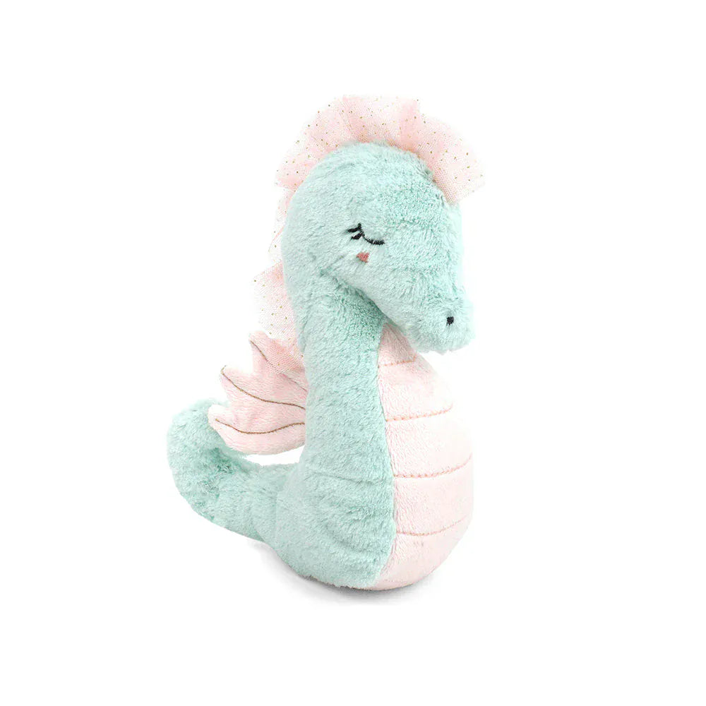 Plush toy dragon with pink wings on a white background