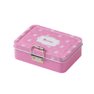 Pink metal lunchbox with bunny and carrot print.